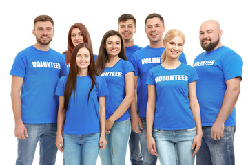 Group of young volunteers on white background