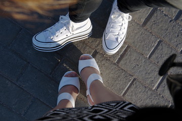 Legs on a sidewalk tile