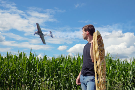A young man holds the wing ribs.