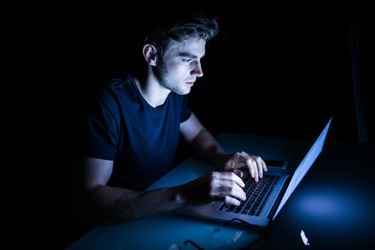 Technology Internet Communication And People Concept Young Man  With Laptop Computer In The Night Time