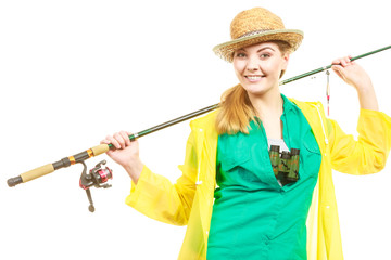 Woman with fishing rod, spinning equipment