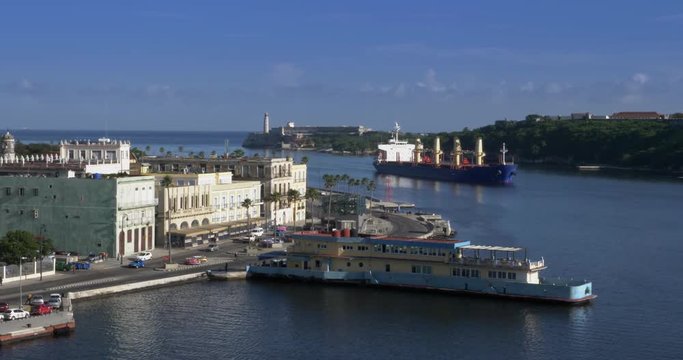 A large freighter cargo ship pulls into Havana Port Bay in Cuba.  	