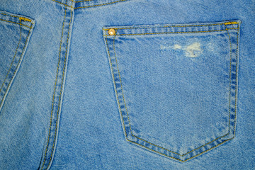 Torn Blue Jeans back pocket texture background