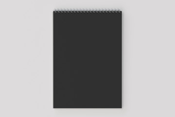 Blank black notebook with metal spiral bound on white background
