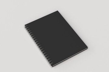 Closed notebook spiral bound on white background