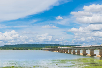 The bridge of  Her Majesty Thepsuda,Lam Pao Dam,Kalasin province,Thailand with the beautiful blue sky and cloud.