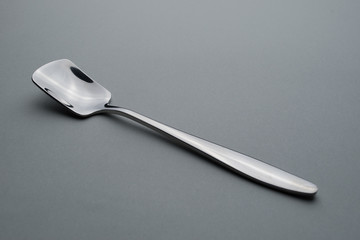 Cutlery on gray background.