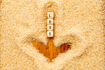 Less Sugar - wooden block letters in downward arrow drawn in sugar