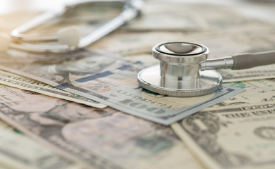medical cost, stethoscope on dollar banknote money. concept of health care costs, finance, health...