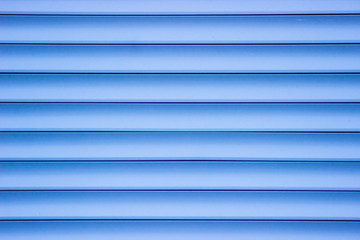 Blue plastic panel siding texture.