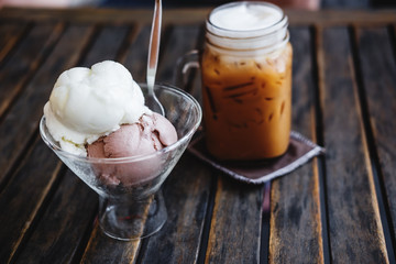 Summer Dessert, Iced Coffee with Ice Creams on wooden table, selective focus on Ice Cream Cup