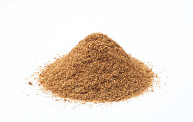 Heap of cumin powder on white background