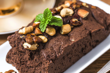 Chocolate cupcakes with mint on wooden table