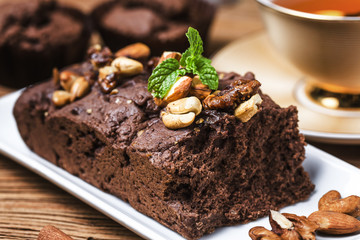 Chocolate cupcakes with mint on wooden table