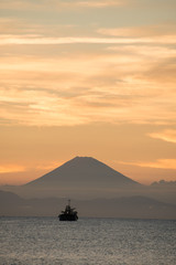 Naklejka na ściany i meble Seas at sunset and Mt. Fuji
