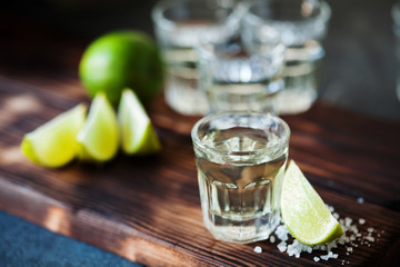 Tequila silver with lime and sea salt decorated with blackberry and mint