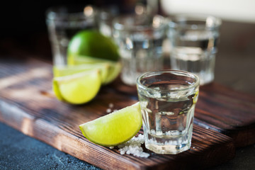 Tequila silver with lime and sea salt decorated with blackberry and mint