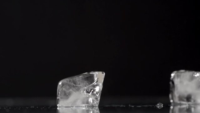 Falling ice cubes on a black background