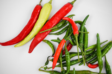 Red and green pepper in a stone mortar.
