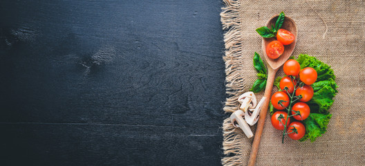 Fresh vegetables on a wooden background. Top view. Free space for your text.