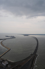 Aerial iew of the Ile de Ré bridge from the sky by helicopter on a grey stormy day (France)