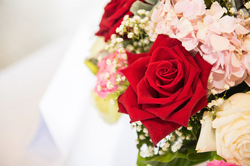 Red and white roses bouquets at weddings and celebrations, copy space.