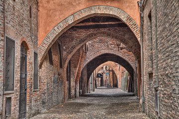 Ferrara, Italy: the medieval alley Via delle Volte - obrazy, fototapety, plakaty