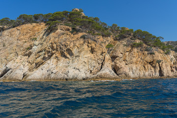 Fototapeta na wymiar View from the sea on a beautiful rocky landscape on a sunny day