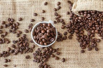 Coffee beans, a cup of coffee, cinnamon