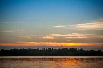 beautiful majestic sunset on the background of the river bank with no people in Dnipro Kiev Ukraine