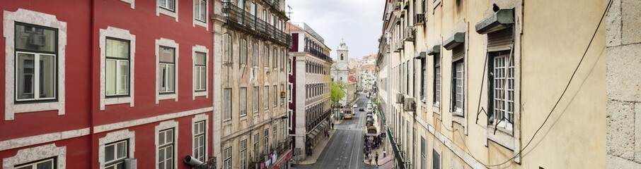 Fototapeta na wymiar street panorama with walls and tramway in Lisbon in Portugal