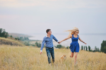 Fototapeta premium Young couple: the guy and the girl on walk, love story