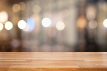Empty wooden table and blur interior background