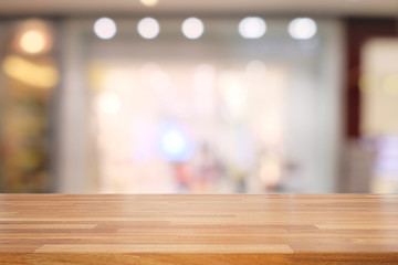 Empty wooden table and blurred  modern kitchen cafe background