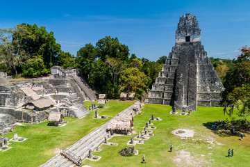 TIKAL, GUATEMALA - MARCH 14, 2016: Tourists at the Gran Plaza at the archaeological site Tikal,...