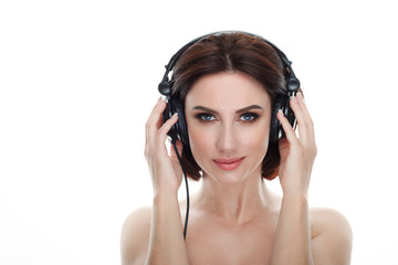 Fototapeta premium Beauty portrait of adult adorable fresh looking brunette woman with gorgeous makeup dj headphones bob hairdo posing against isolated white background showing emotion and facial expression concept.