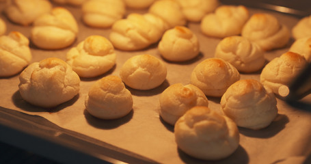 cooking profiteroles in oven closeup