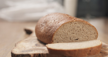 slices of rye wheat rustic bread on cutting board