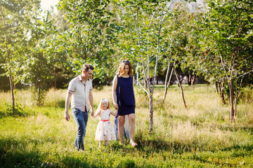 Fototapeta premium Happy family in the Park fun walk