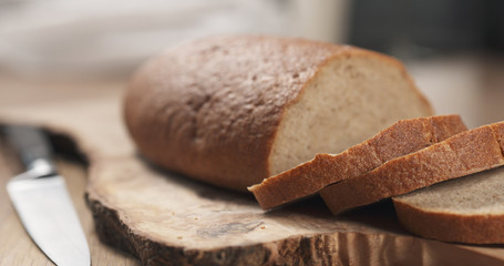 slices of rye wheat rustic bread on cutting board