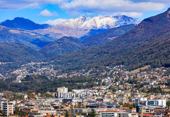Buildings of the city of Lugano in Switzerland, mountains in the background