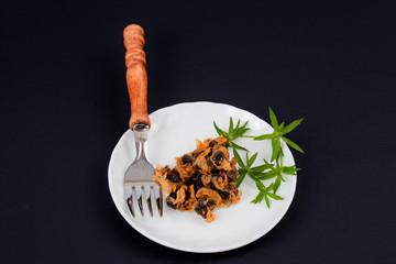 sea food sweet dried clams on dish with fork