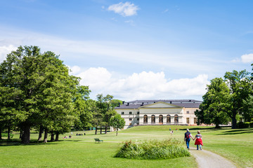 View over Drottningholm Palace and park on a sunny summer day. Home residence of Swedish royal family. Famous landmark and tourist destination in Stockholm, Sweden