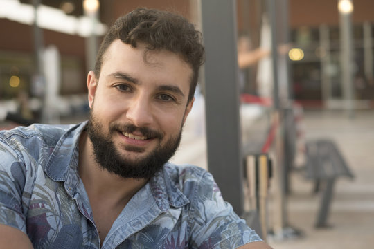 35 Years Old Man Looking At Camera In Restaurant Terrace