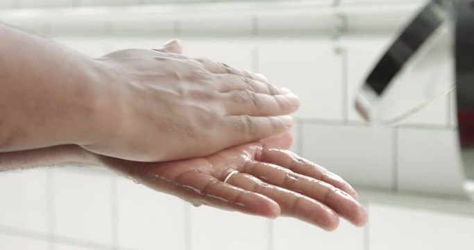 mixed race man's hand with a lotion after shave