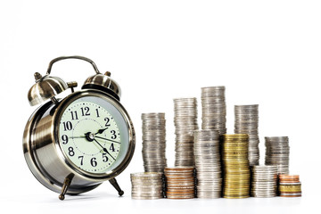 Stacks of coins and clock over white background, Conception of business, money and business growth.