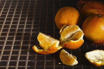 Ripe juicy tangerines lying on the table