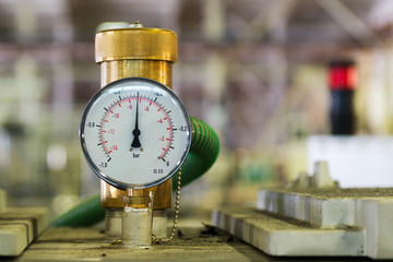 Closeup of a pressure meter on a machine