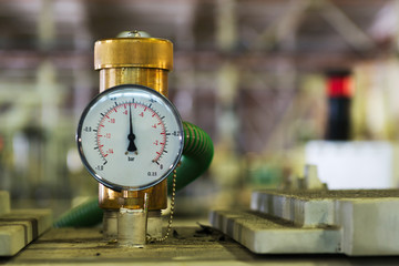 Closeup of a pressure meter on a machine