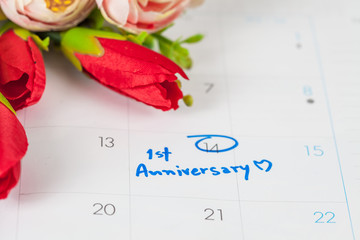 word anniversary celebration plan on calendar with flower.